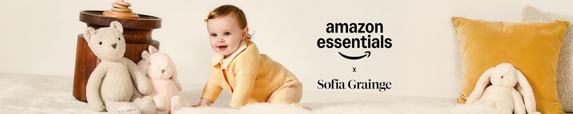 Baby with Amazon Essentials and Sofia Grainge toys.